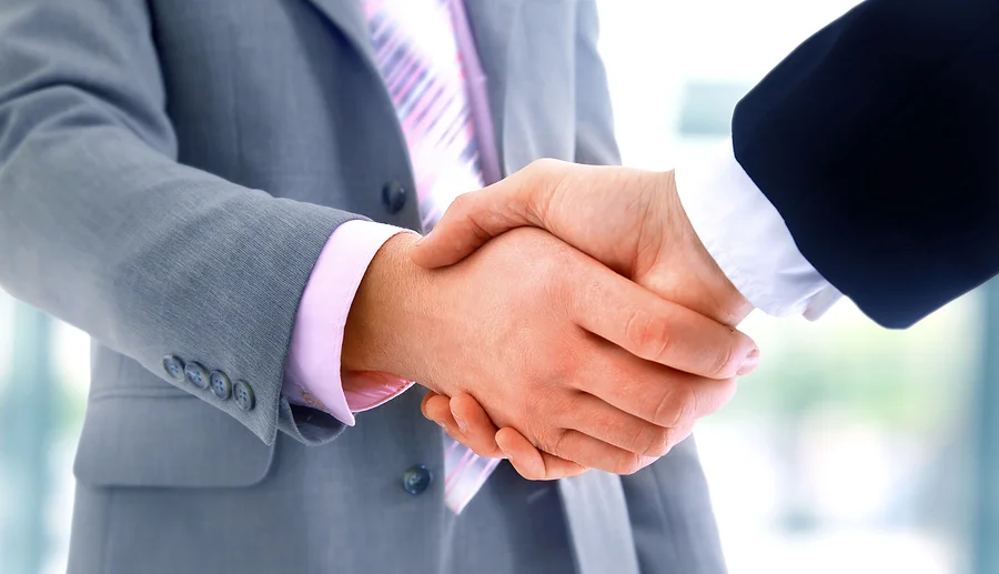 An image of two businessmen agreeing DMAIC Project Validation